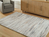 Bay Furniture Gallery - Ashley Furniture - Nace Rug - 5' x 7' Area Rug / Gray/Brown/White - R407472